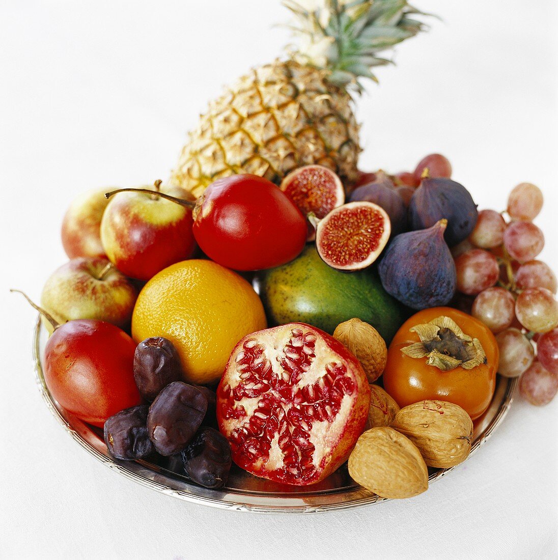 Plate of fruit with walnuts