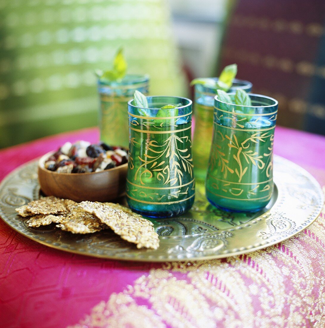 Peppermint tea and snacks on silver tray