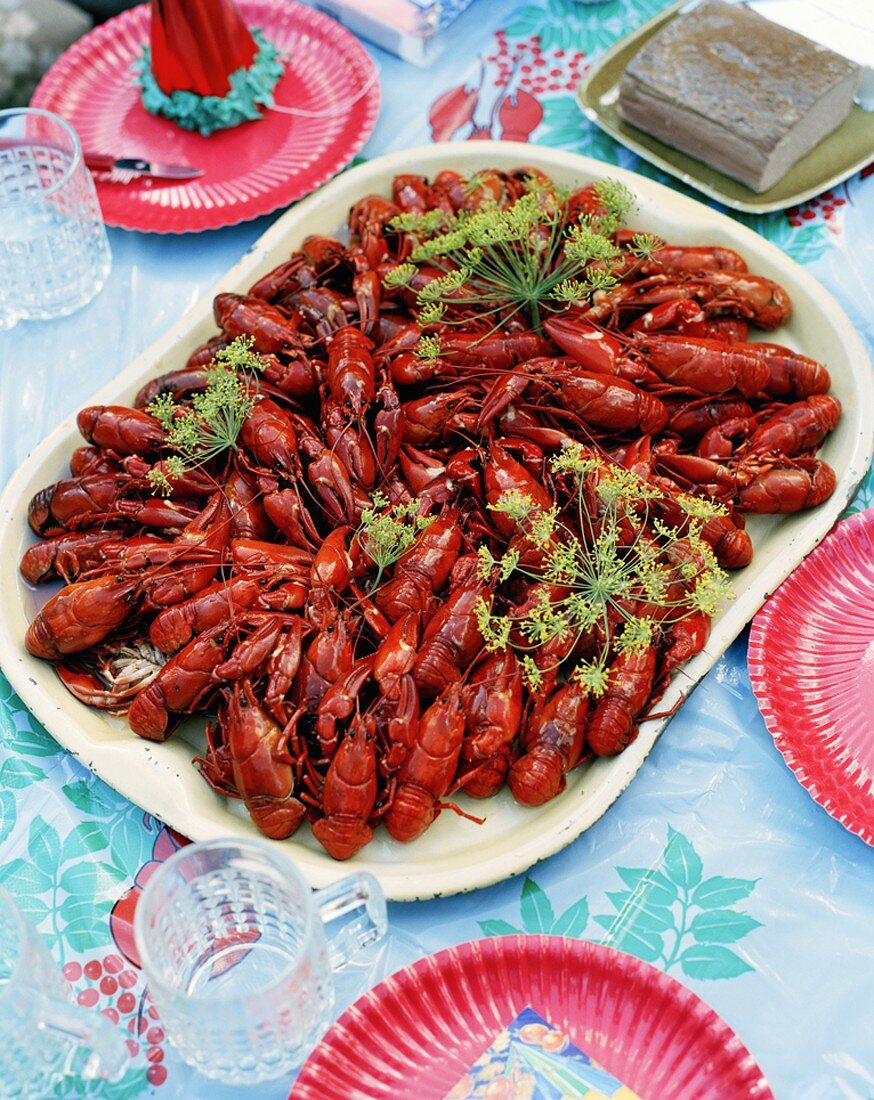 Lots of steamed crayfish on a serving dish
