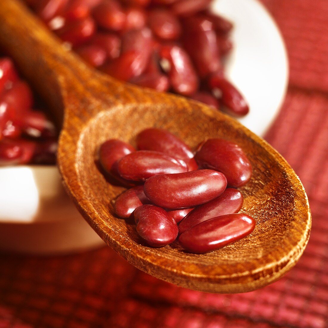 Red kidney beans on a wooden spoon