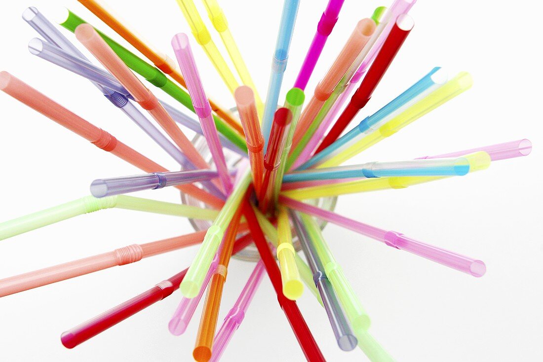 Coloured straws in a glass