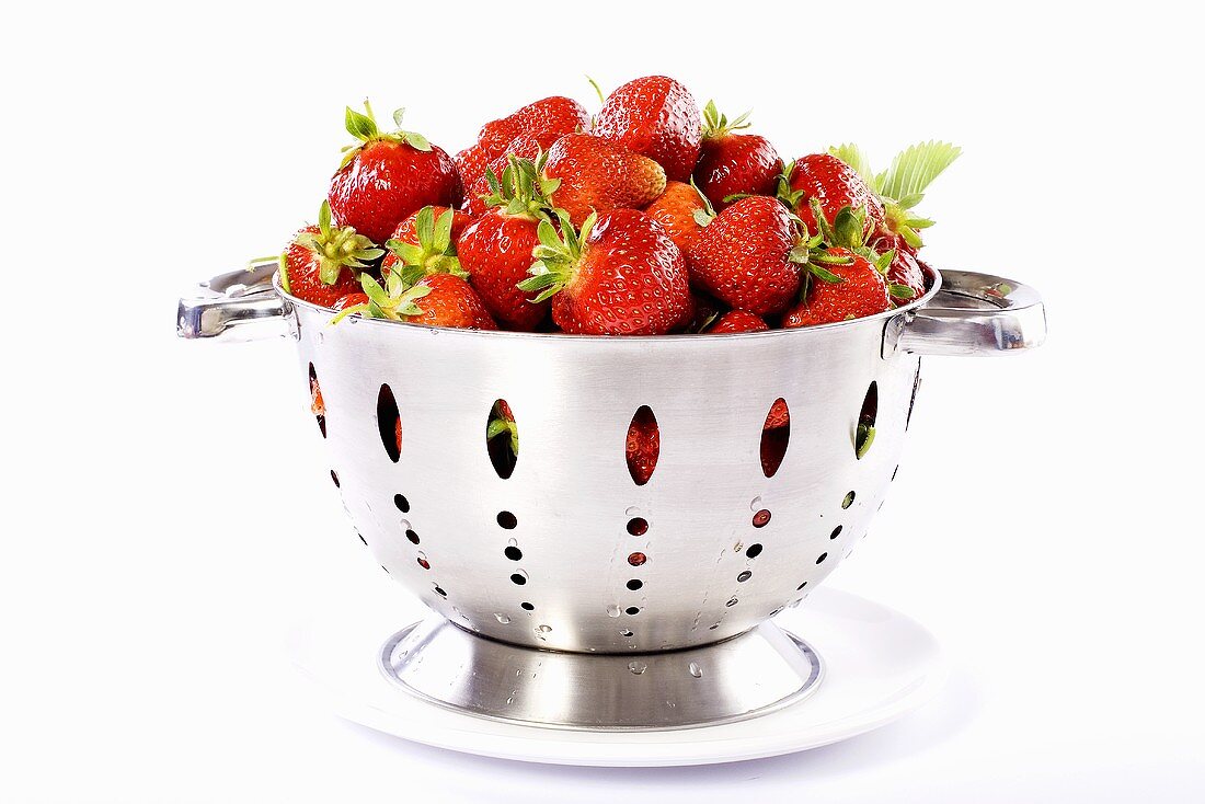 Fresh strawberries in a colander