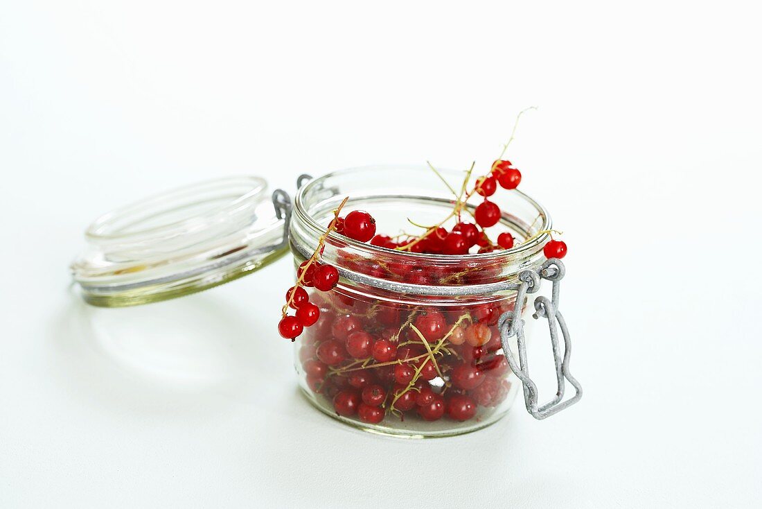 Redcurrants in preserving jar