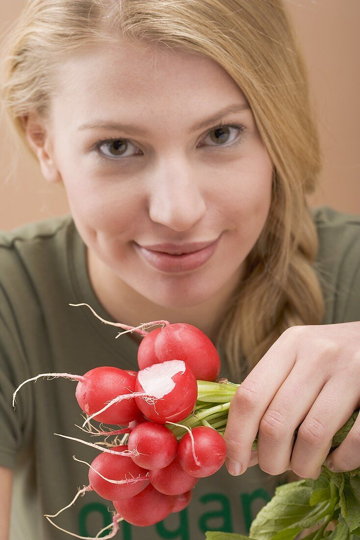 Woman holding radishes
