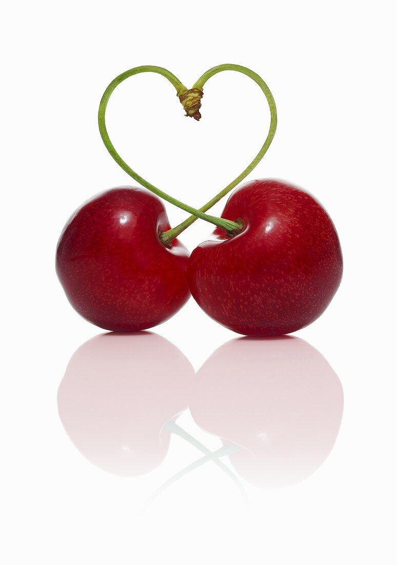 Pair of cherries forming a heart