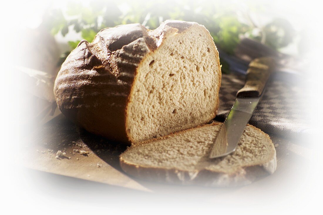 Crusty bread, partly sliced