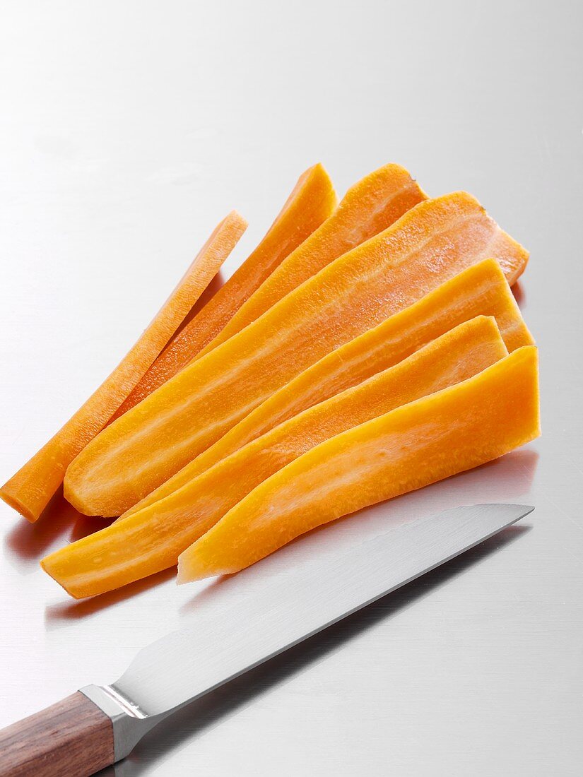 Sliced carrots with knife