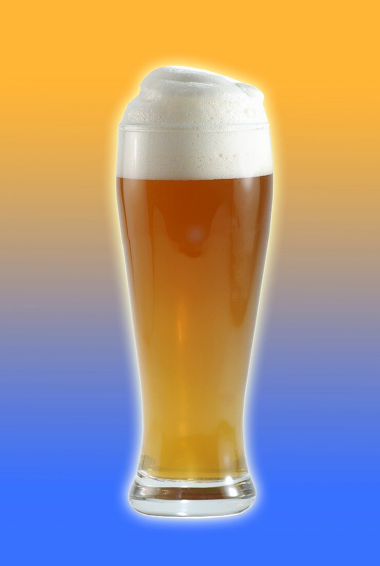 Glass of wheat beer with head