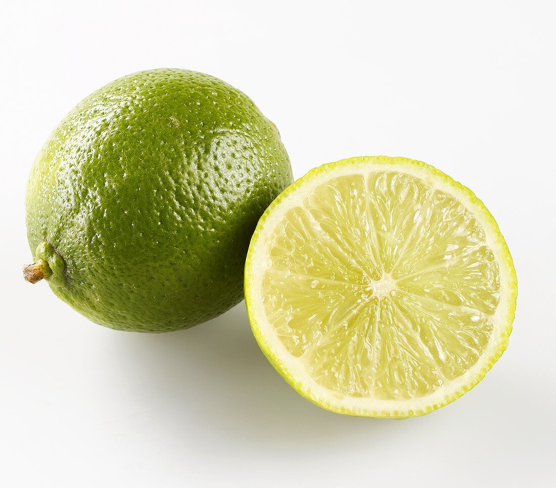 Half and Whole Lime on White Background