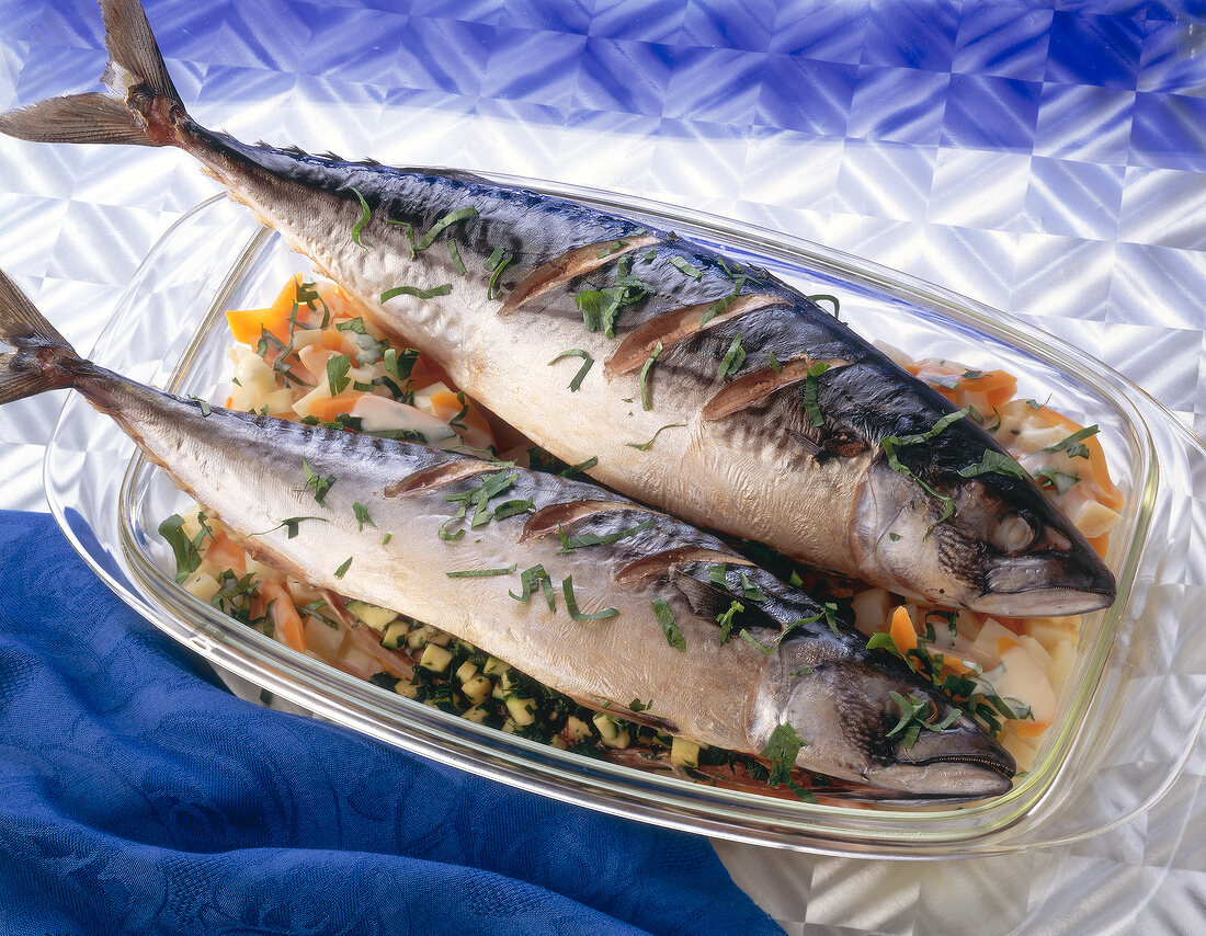 Mackerel stuffed with herbs, zucchini, carrots and celery