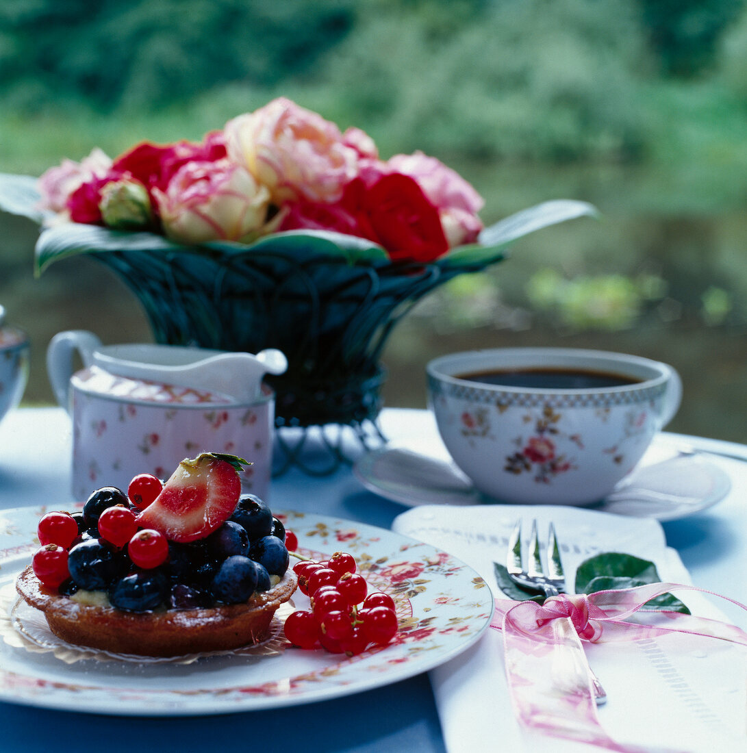 Assorted berries on floral plate, coffee table