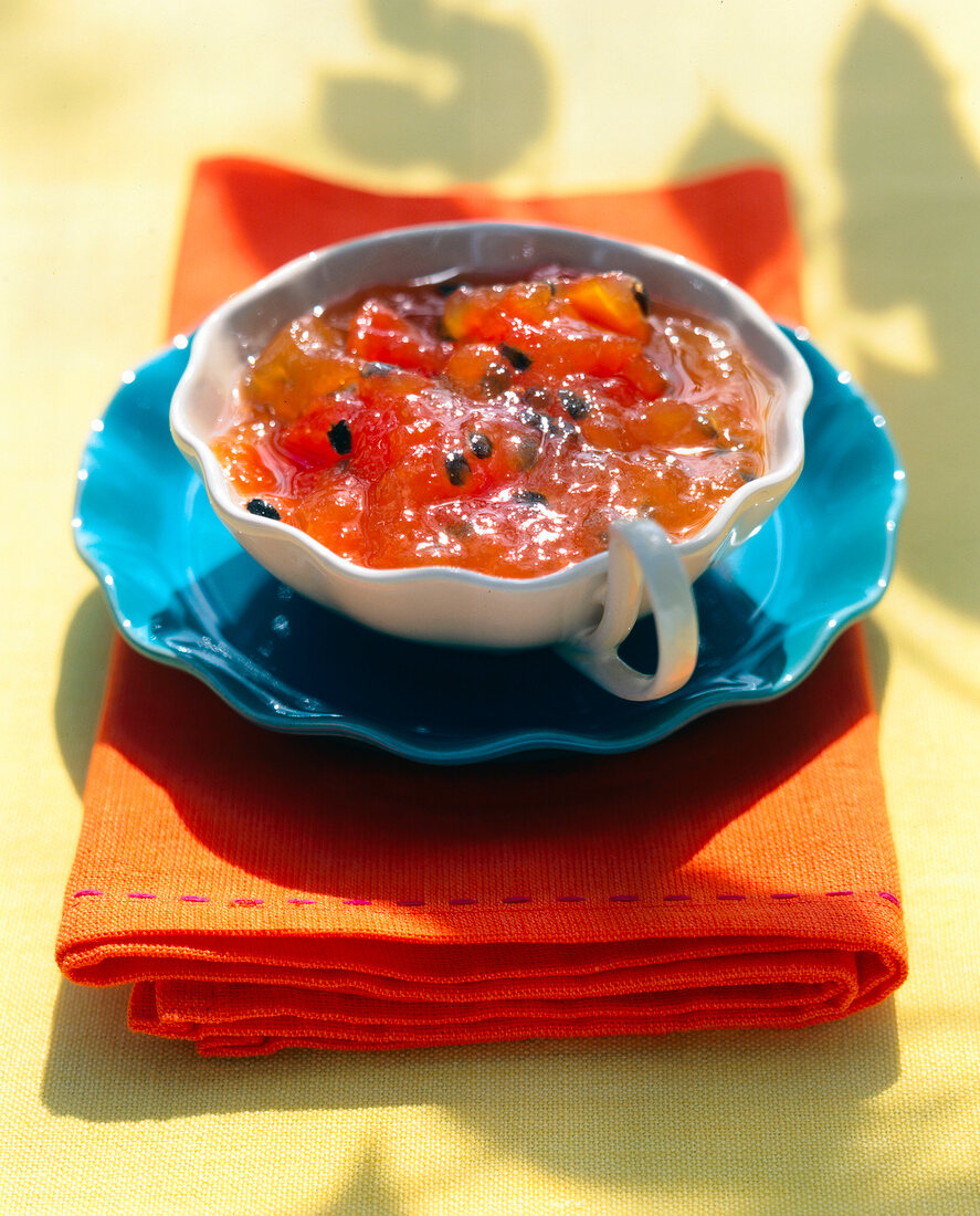 Exotic jam made of papaya, orange, lemon and passion fruit in bowl