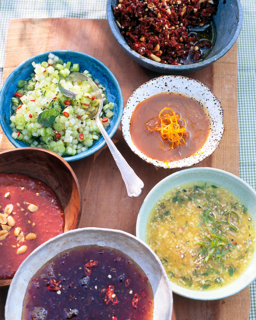 Variety of sauces and marinades in bowls for barbecue