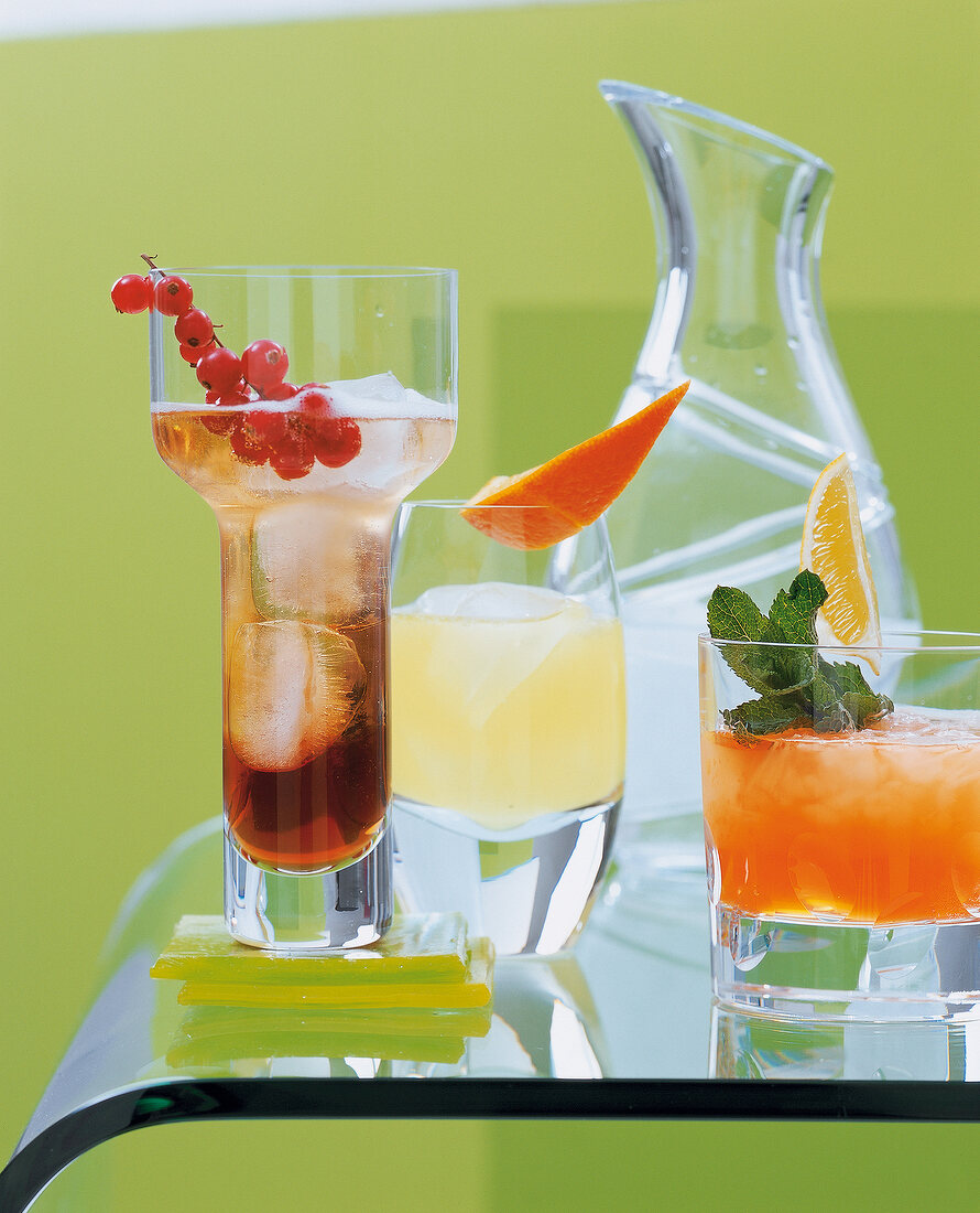 Cocktails against green background