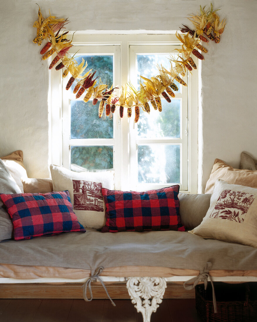 Window decorated with corn garland