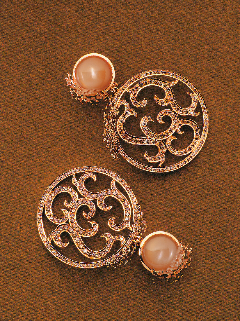 Pair of rose gold oriental earrings