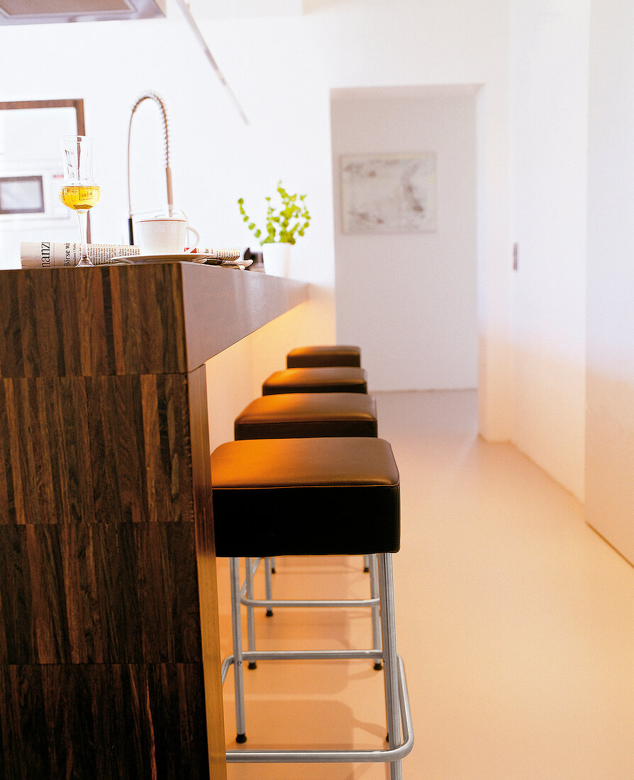 Close-up of counter and bar stools in kitchen