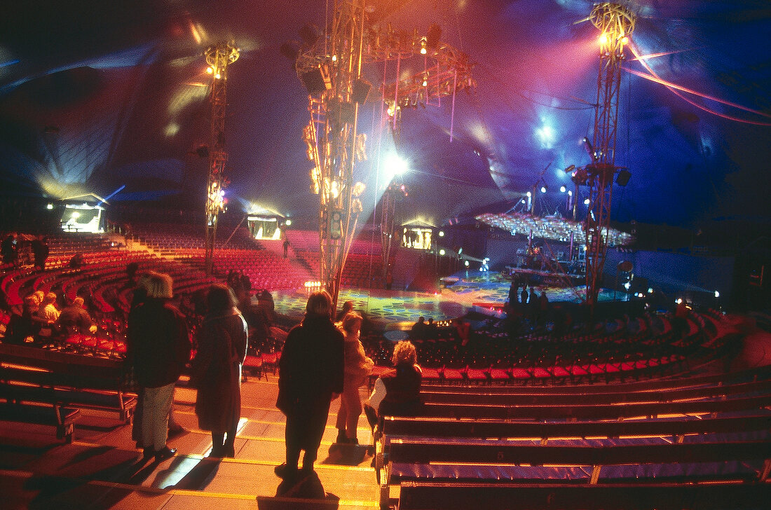 Cirque du Soleil with spectators in coloured light