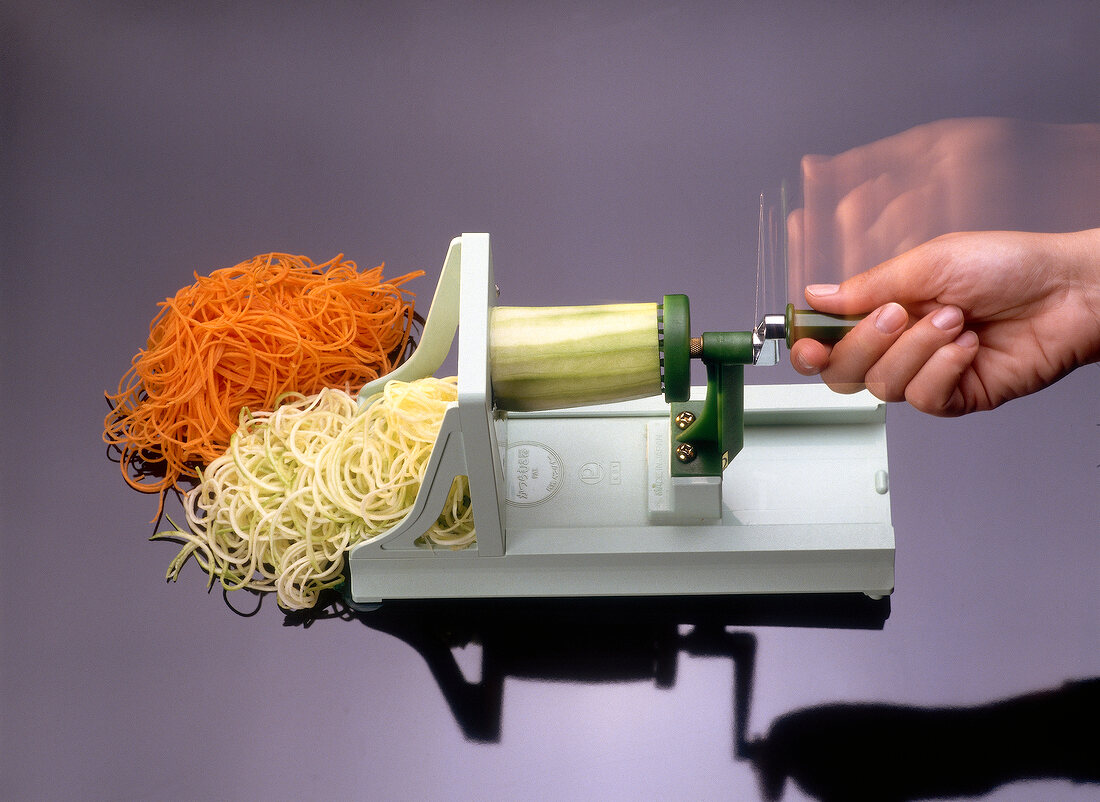 Cutting vegetables in winding machine, blurred motion