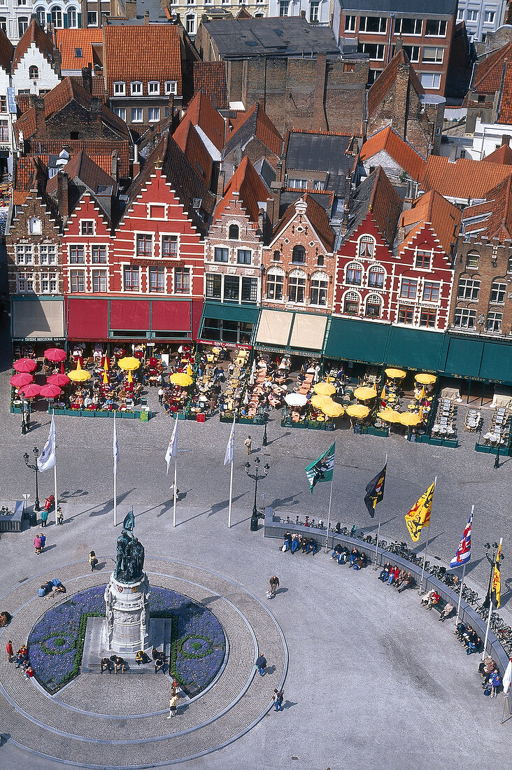 Elevated view of market place of Bruges with half-timbered houses and old watchtower