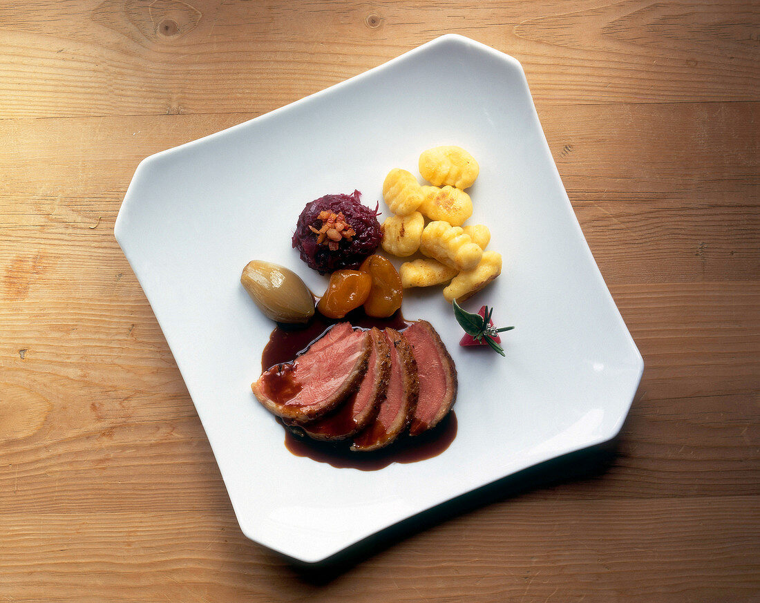 Gnocchi and challans duck with salt crust on plate