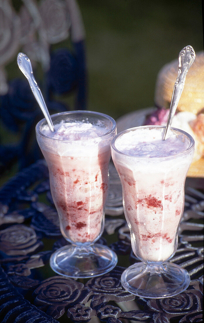 Ice cream soda in two glasses with spoons