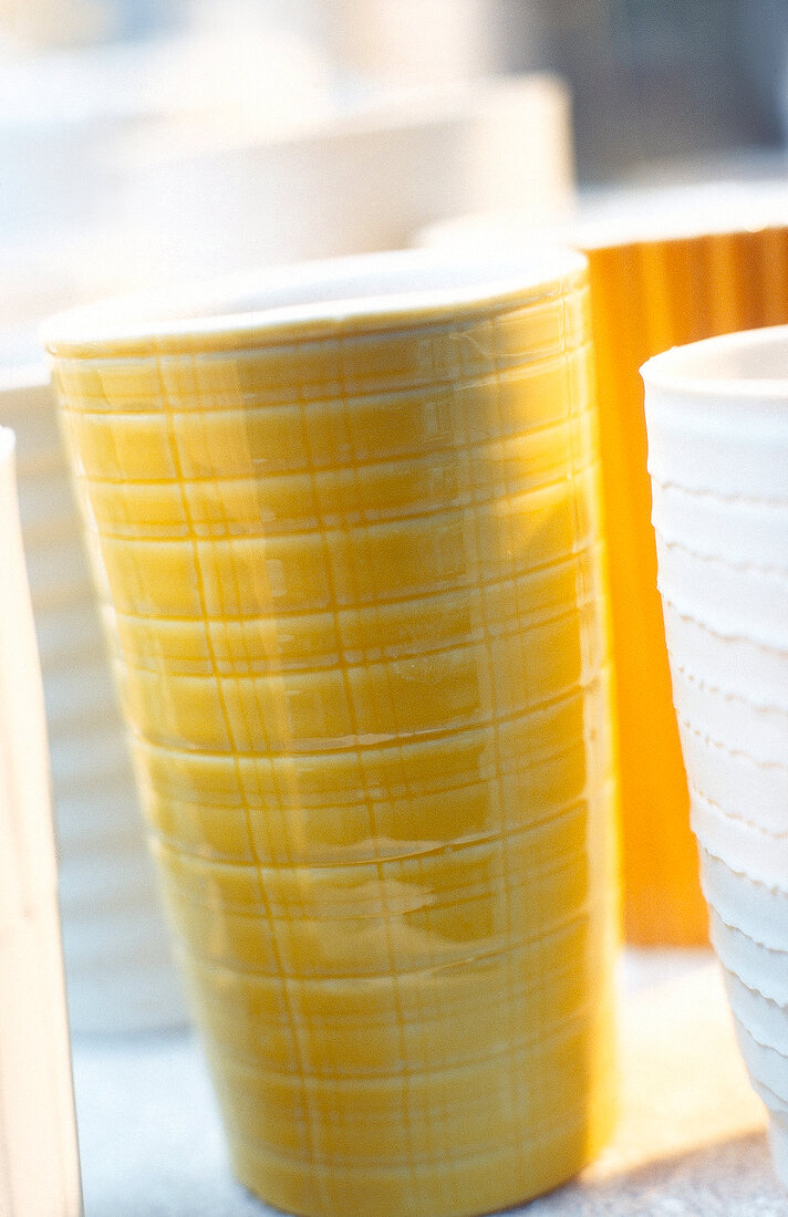 Close-up of yellow porcelain cup