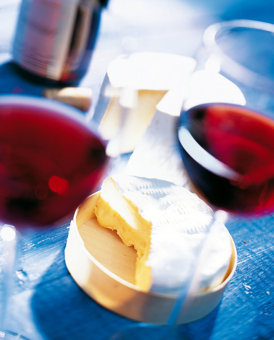 Close-up of French soft cheese and red wine