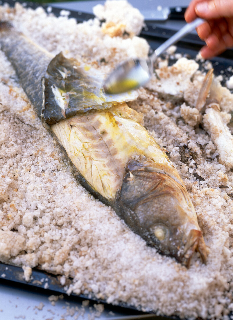 Catfish in salt during preparation