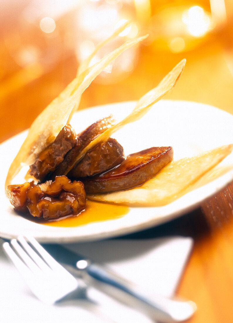 Close-up of mille-feuille of foie gras, chestnuts and sweet potatoes on plate