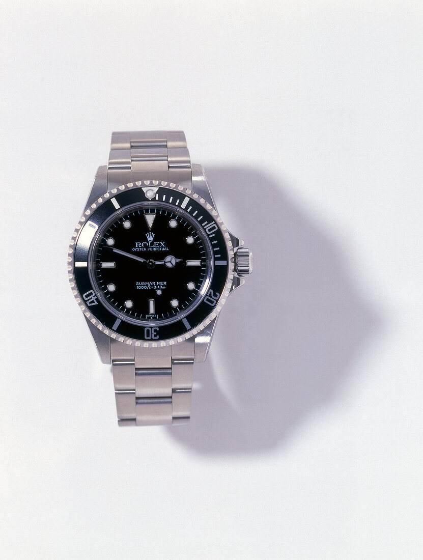 Submariner wrist watch on white background
