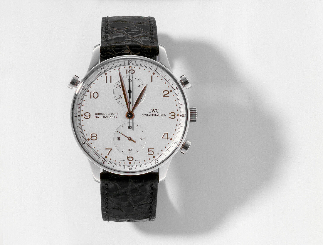 Close-up of wrist watch on white background