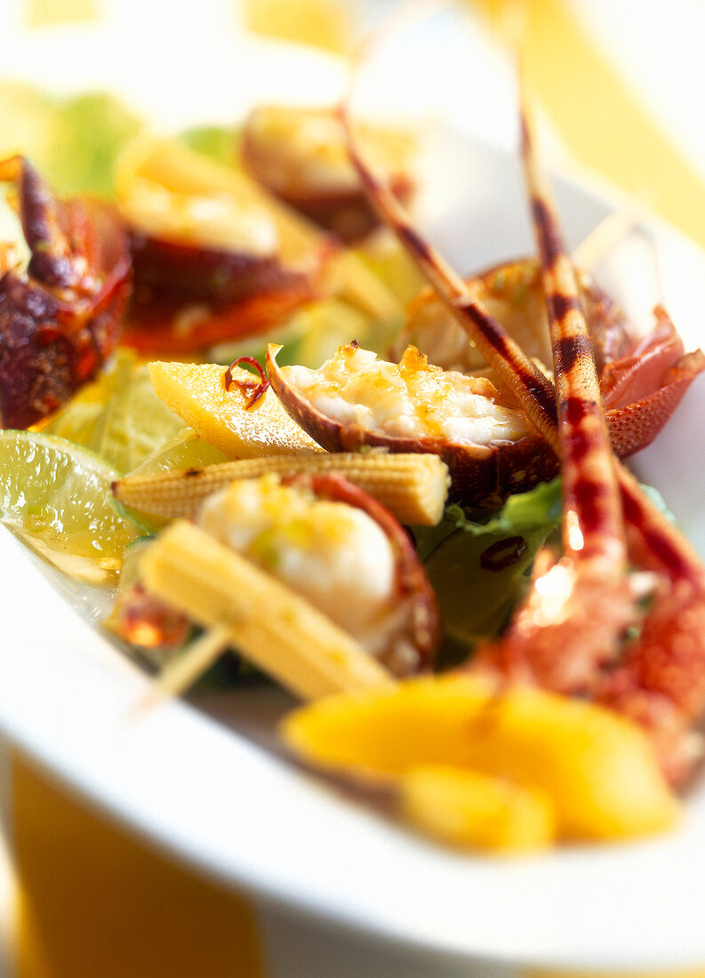 Close-up of lobster with mango-lime salad on plate