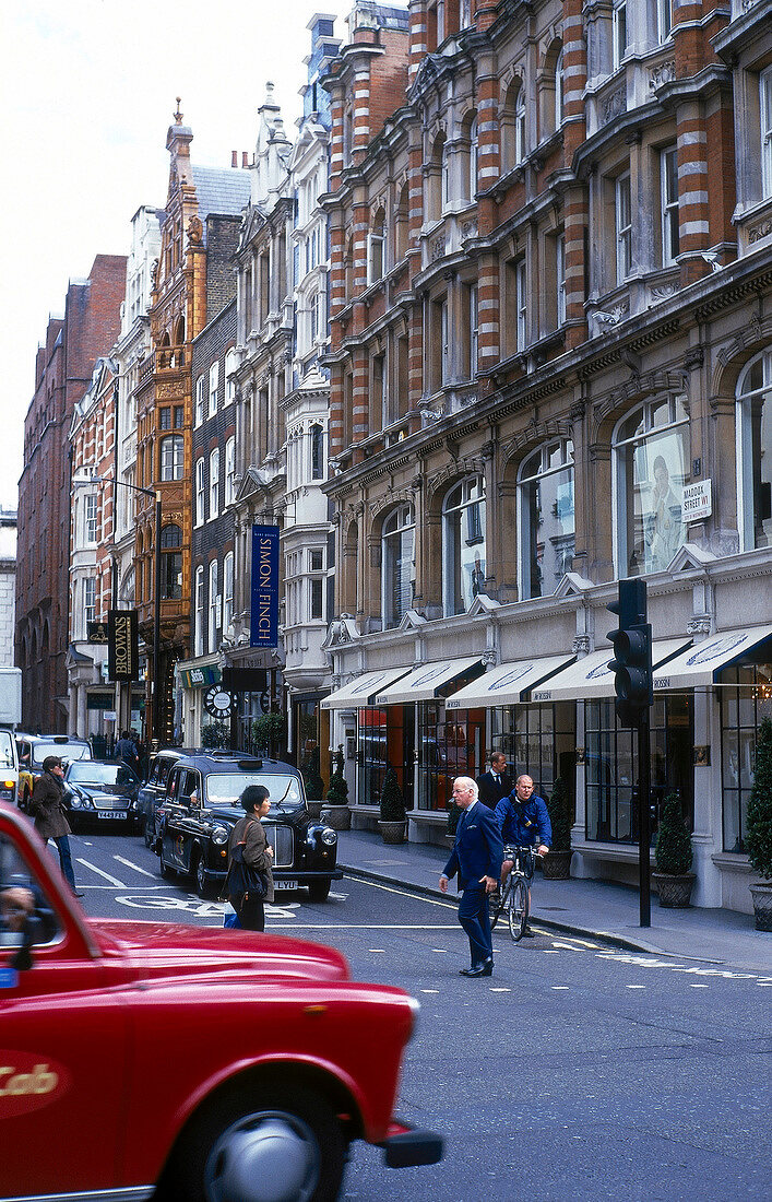 View of elegant facades of houses and pedestrians at Mayfair