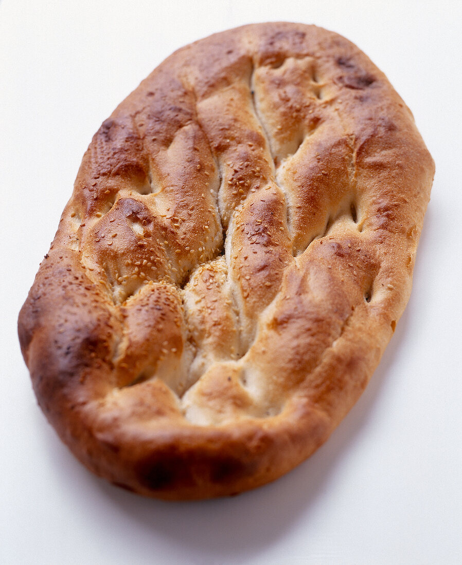 Close-up of soft pita bread with sesame and caraway