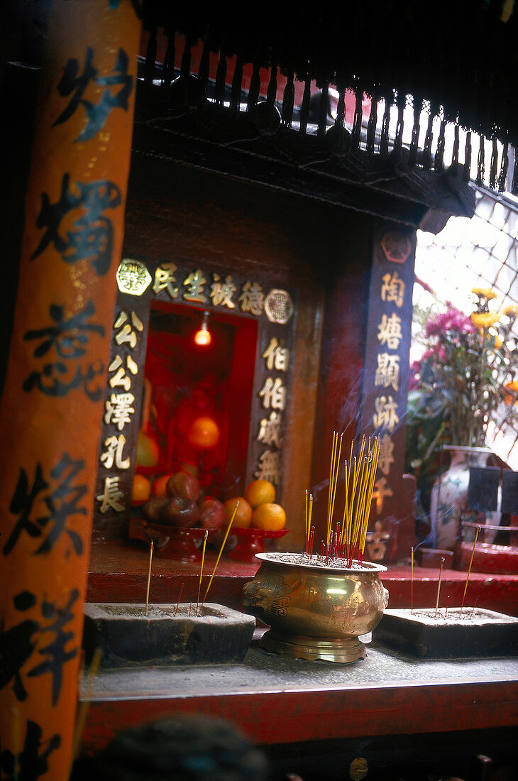 Burning incense in Buddhist temple, Hong Kong, China