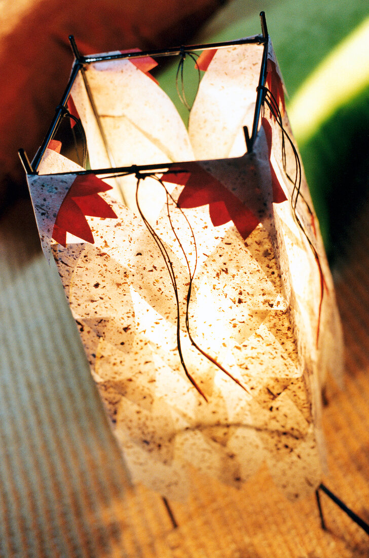Close-up of illuminated handmade lantern with Japanese paper