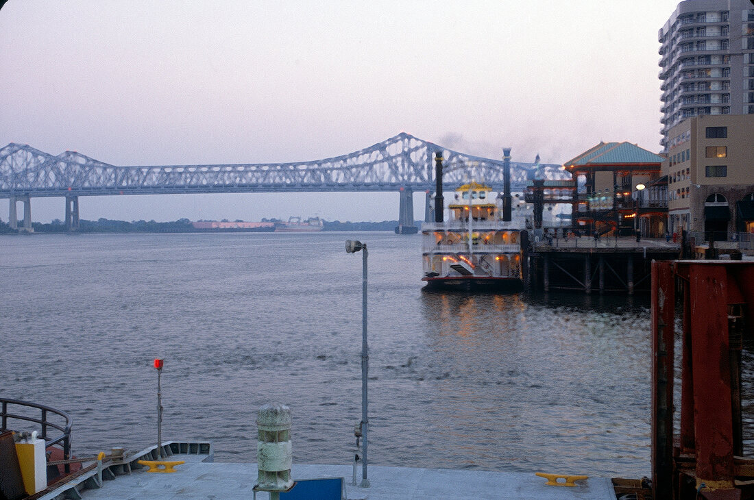 View of the Mississippi River with iron bridge in New Orleans