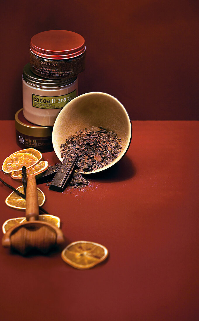 Chocolate, blood oranges and creams on brown background