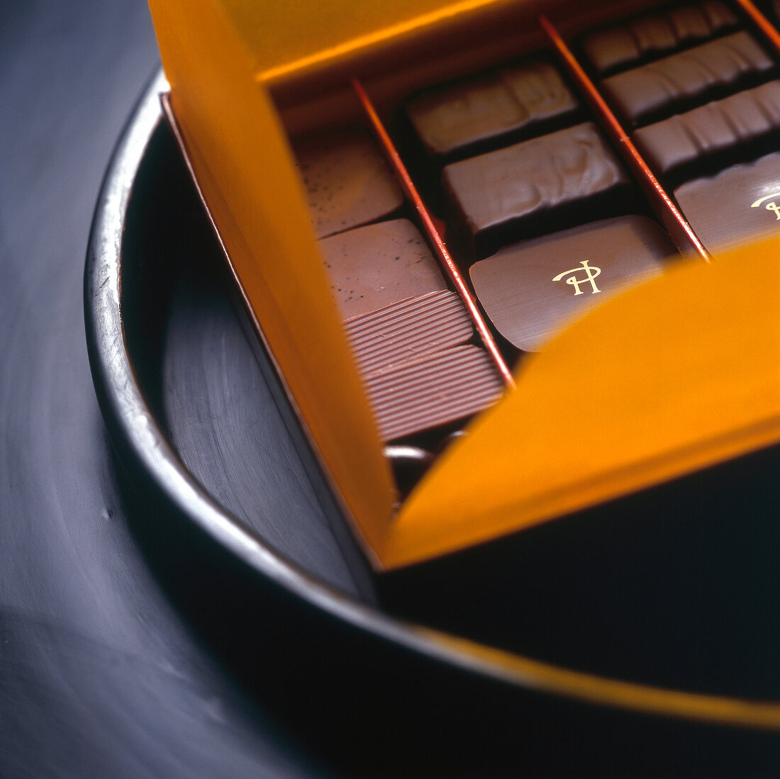 Close-up of fine French chocolate in open gift box