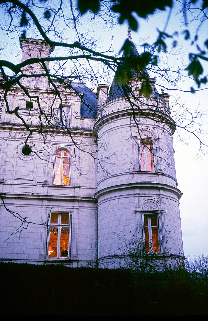 View of Domaine de la Tortiniere castle on Loire River at Dusk, Veigne, France