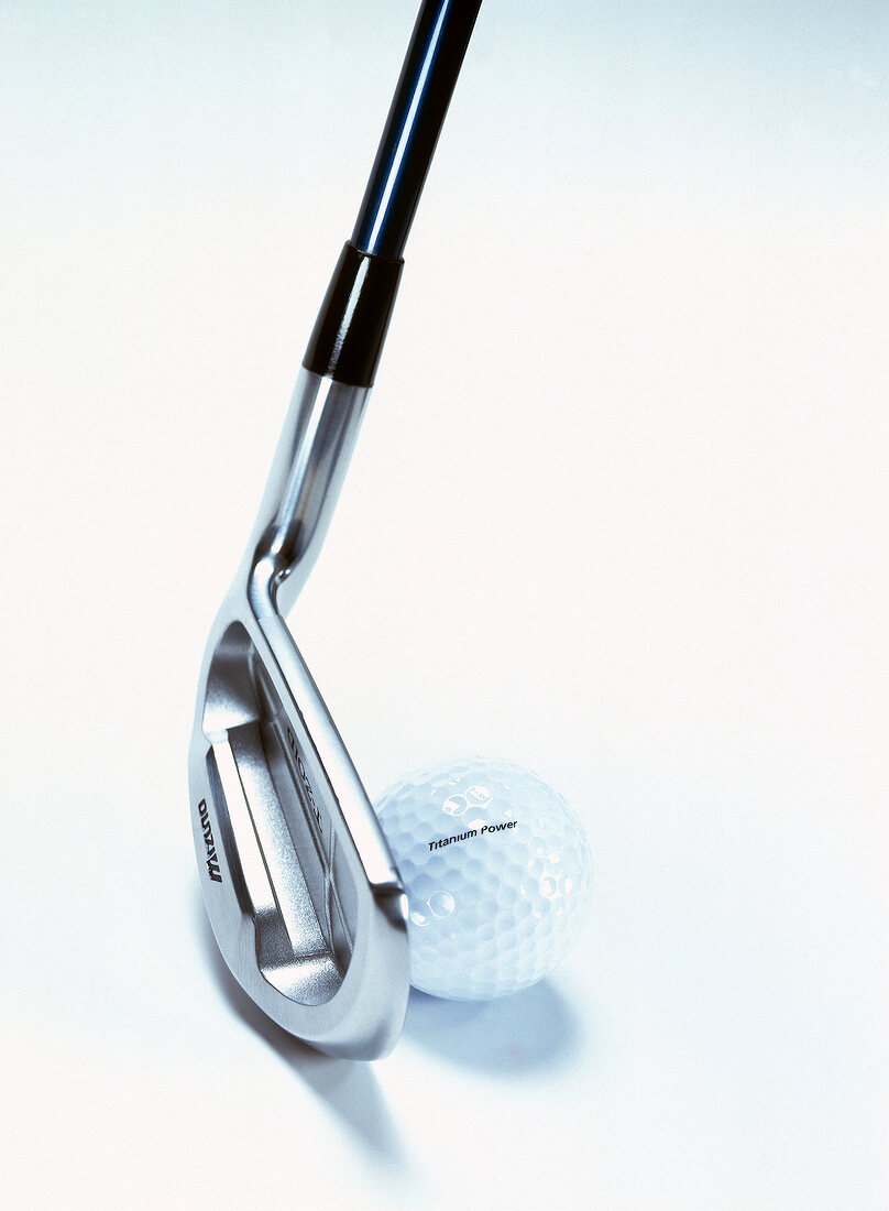 Golf stick with golf ball on white background