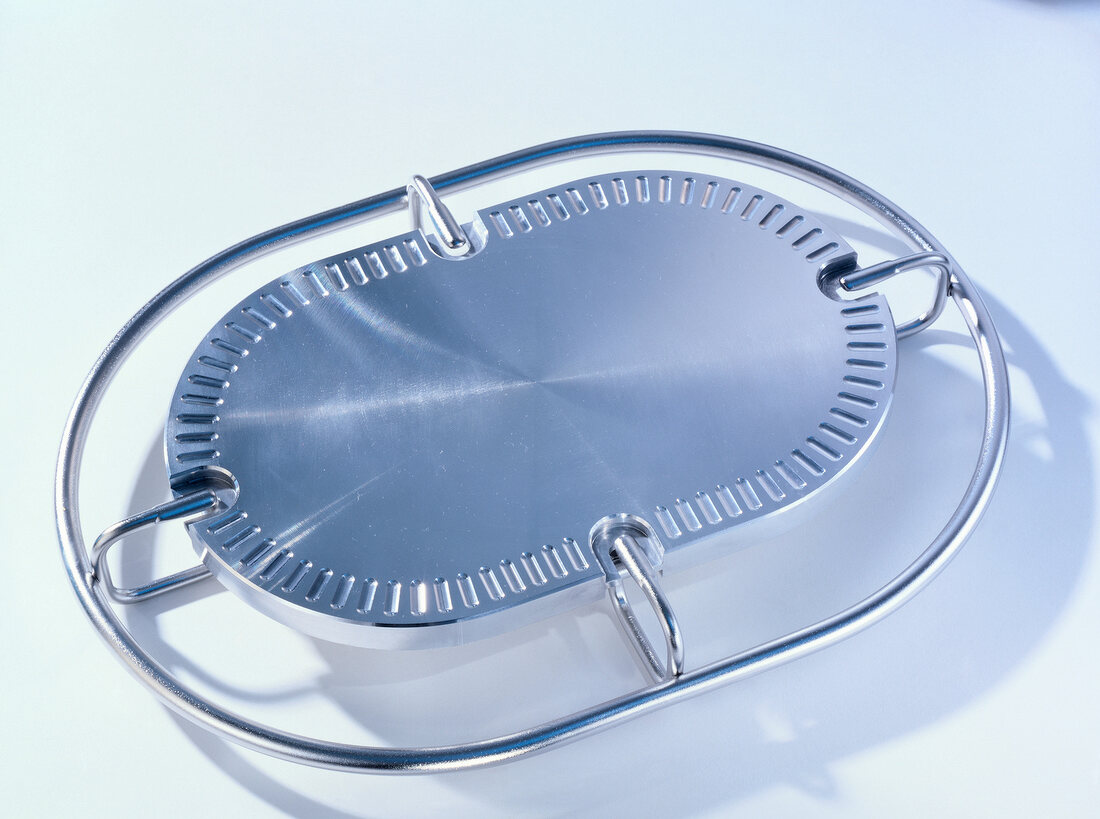 Close-up of aluminium heating plate on white background