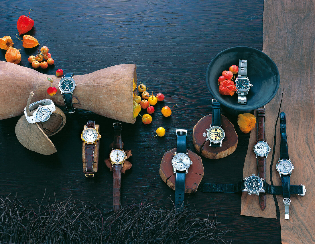 Various luxury watches on wood