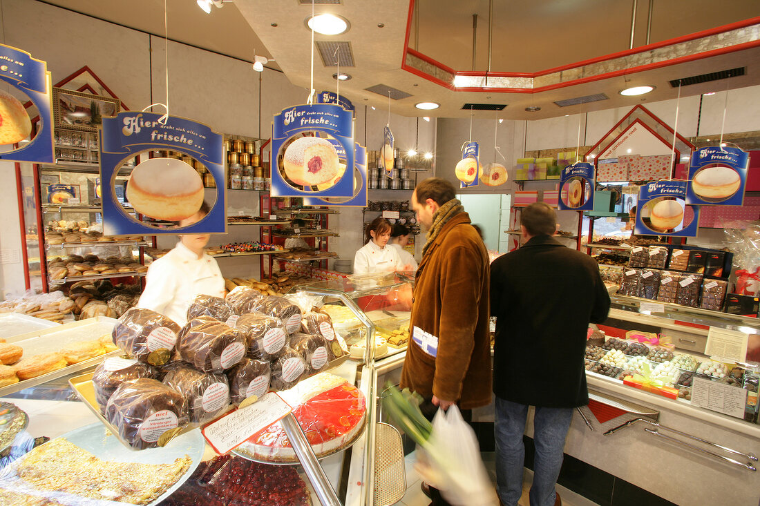 People buying goods in store, Germany