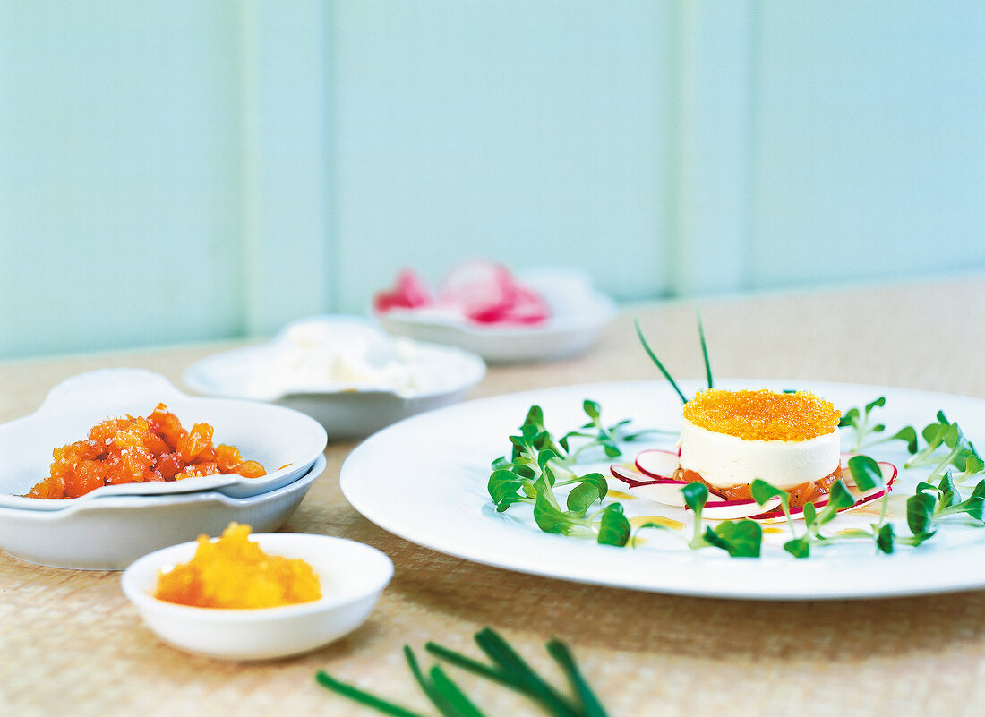 Close-up of white fish caviar and fish on plate