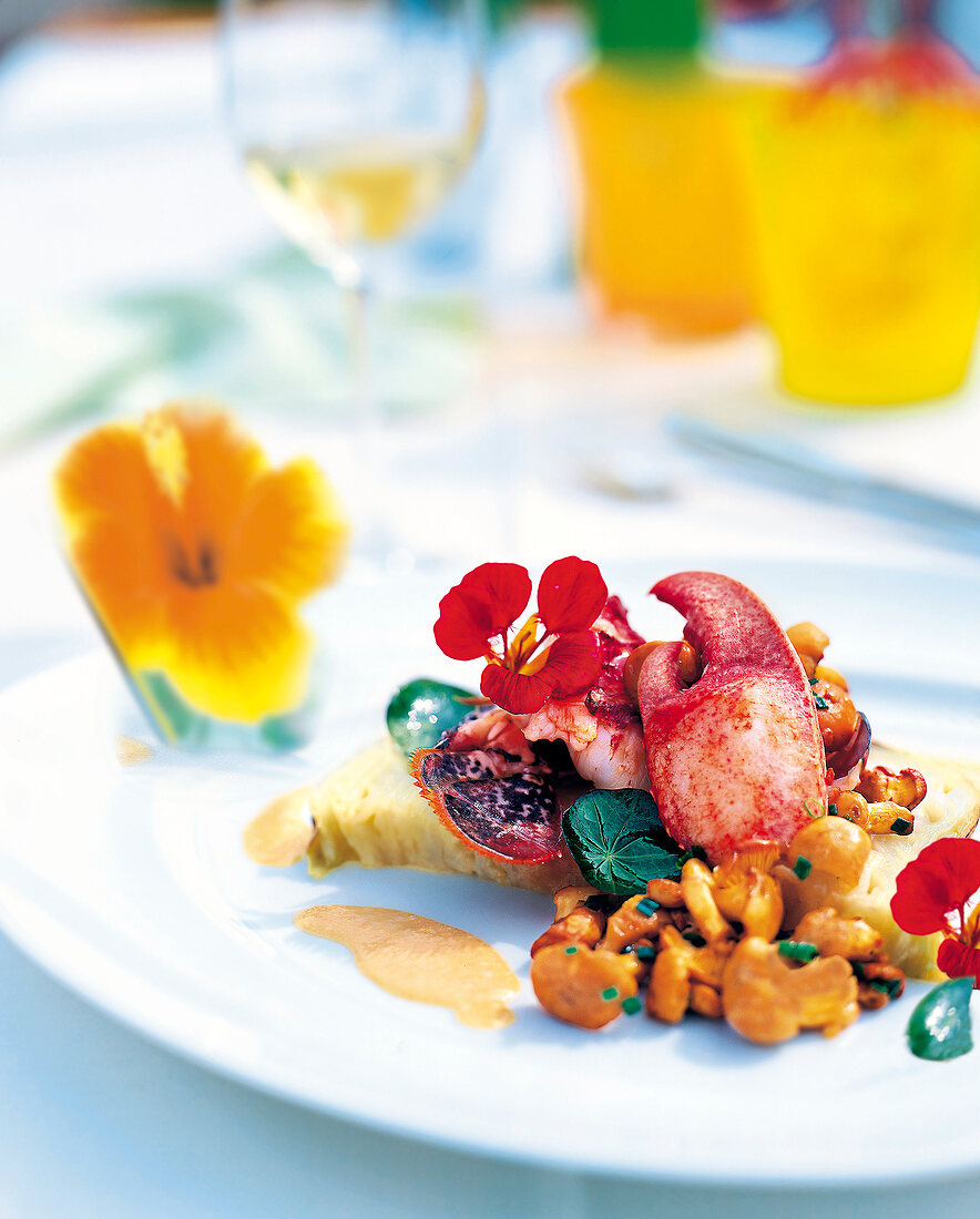 Lobster with cabbage and chanterelles on plate