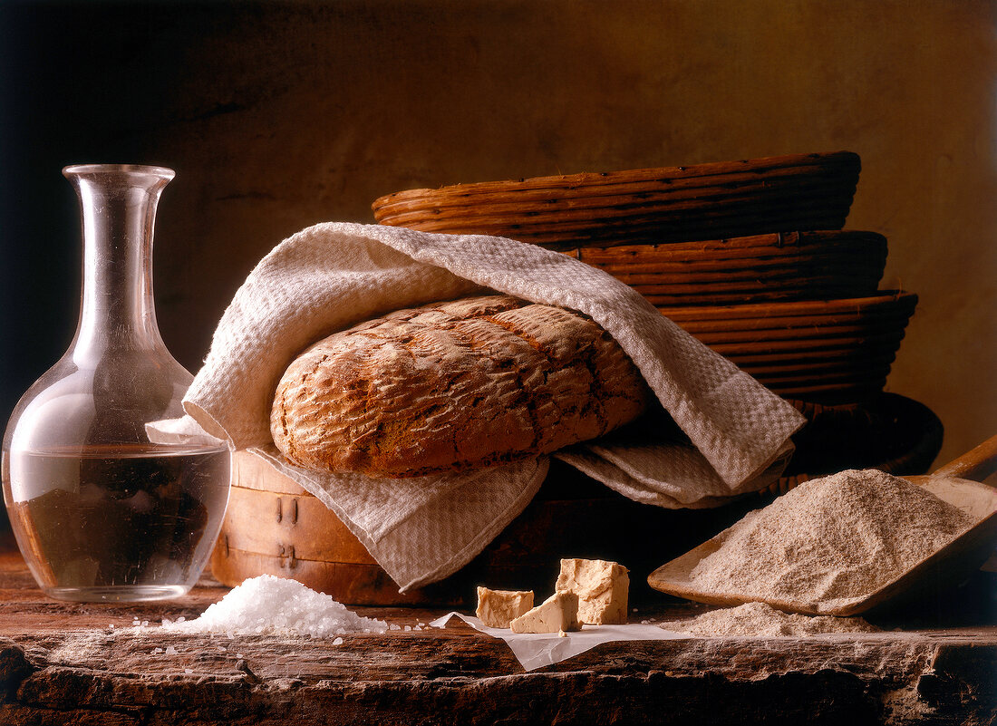 Country bread with ingredients for baking bread