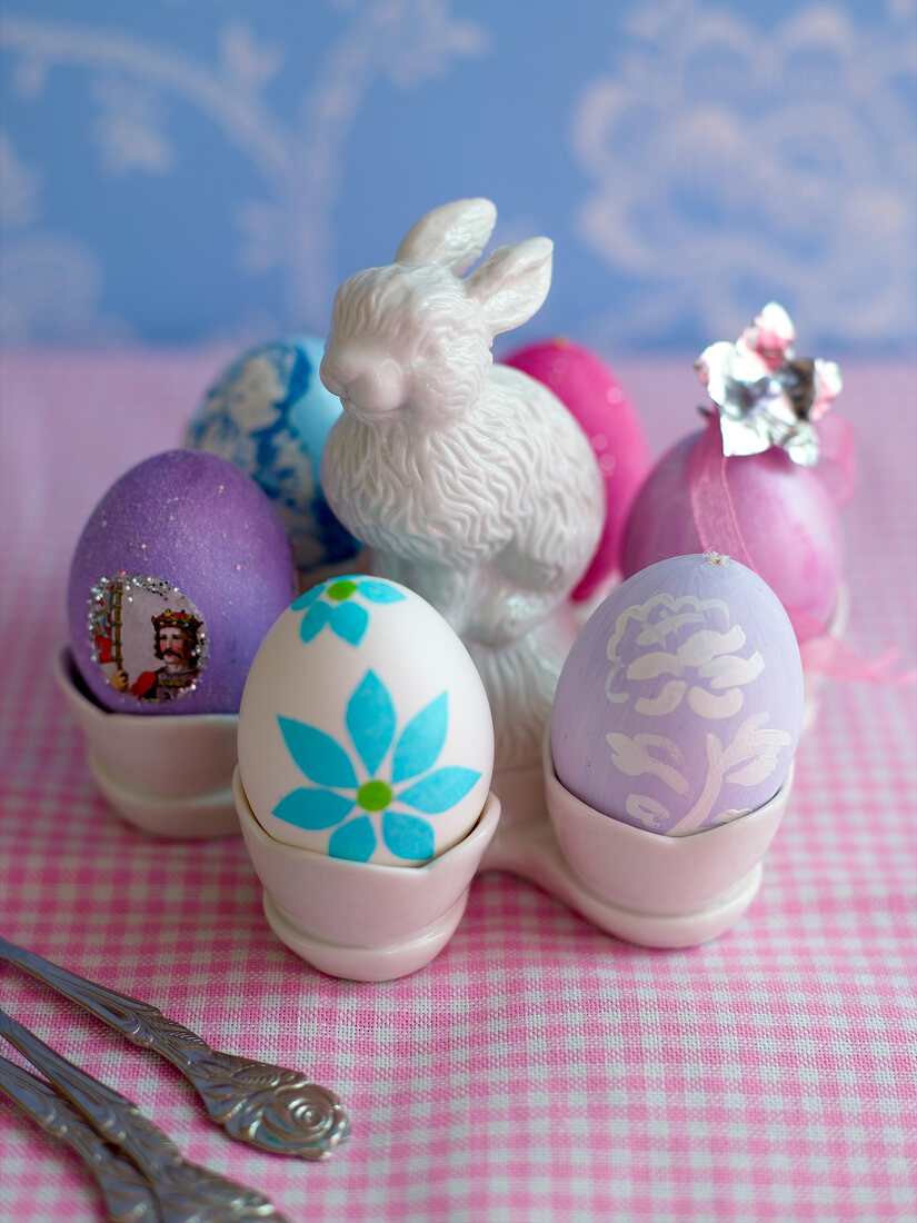 Porcelain egg cup with six coloured eggs and porcelain hare