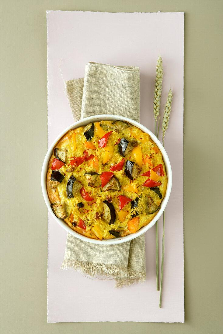 Oriental millet baked in casserole on napkin